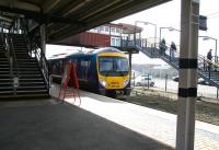A Manchester Airport - Newcastle Central service calls at York's outside platform 11 on 21 March 2010. The stairway on the right leads to the west side station car park and across Leeman Road to the National Railway Museum. <br><br>[John Furnevel /03/2010]