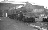<I>King Henry VII</I> stands in the yard of the former Stafford Road works in Wolverhampton, on 15 August 1962. The locomotive, which had been withdrawn from nearby 84A Stafford Road shed in September of that year, was cut up in a local scrapyard the following March.<br><br>[K A Gray 15/08/1962]