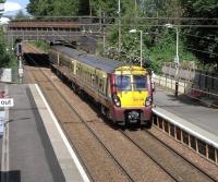 334 016 with a Dalmuir to Springburn service at Scotstounhill station on 19 June 2010.<br><br>[David Panton 19/06/2010]