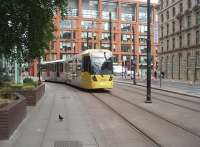 The <I>new order</I> on Manchester's Metrolink as Tram 3006 climbs to Piccadilly Gardens on a Piccadilly station to Eccles service. The stations are steadily being improved and rebranded in this new corporate scheme of yellow and grey but the earlier 10xx and 20xx series trams are all still in the original turquoise, white and grey livery. <br><br>[Mark Bartlett 09/07/2010]
