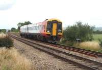 South West Trains 158890 comes off the long straight section south of Aschurch heading for Cheltenham and the South Coast. The train is aproaching the AHB level crossing at Tredington and the sweeping curve to the south of this location.<br><br>[Mark Bartlett 17/07/2010]
