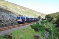 A southbound service heads for the narrows at Slochd Summit loop.<br><br>[Ewan Crawford 22/07/2010]