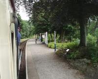 A train for Lakeside runs in to Newby Bridge Halt on 29 July behind 0-6-0ST <I>Repulse</I>. Summer trains on the LHR can be very busy and the six MkI coaches on this service were well loaded, mainly with passengers on combined tickets that include a cruise on Windermere. <br><br>[Mark Bartlett 29/07/2010]