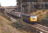 86222 speeds north on the WCML between Rugeley and Stafford in September 1974 and will shortly enterthe 776 yard Shugborough Tunnel. The train is thought to be a mid afternoon Euston toLiverpool Lime Street service.<br>
<br><br>[Bill Jamieson 14/09/1974]