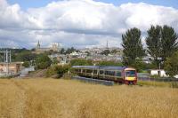 An SPT-liveried 170 approaches Charlestown Junction with Dunfermline's skyline in the background. A south to west chord has been proposed here, passing through the old gasworks site on the left. This would accommodate direct Stirling - Alloa - Edinburgh (and Rosyth freight) trains without the need for reversal.<br>
<br><br>[Bill Roberton 16/08/2010]
