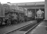 43006 and 44439 are amongst the locomotives on 12D Workington shed in September 1962. Closed to steam in 1968 the 12-road shed was later used as a diesel depot (WK) and finally as a wagon repair shop, before being abandoned in 1995. In 2006 the old shed was purchased by the Great Central Railway, Loughborough, to where it was later moved in sections.<br><br>[K A Gray 22/09/1962]