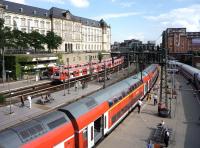 The start of the Hamburg evening rush hour on 27 July 2010. On the left of the photograph two local services are departing the station almost in unison, while in the centre a double decker service for Lubeck awaits its departure time, as does an ICE train on the right.<br><br>[John Steven 27/07/2010]
