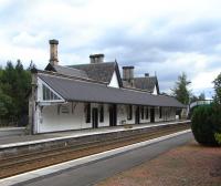 Dunkeld's station building is long out of rail use, but it has an <br>
occupier and is maintained in fine order, as can be seen in this study of 20 September. When the station opened it was the end of the line for 7 years and had an overall roof.  This can still be imagined from the substantial wall, now supporting the canopy, which would once have been replicated on the other platform.<br><br>[David Panton 20/09/2010]