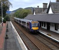 On 20 September 170 419 pulls into Dunkeld & Birnam with an Inverness to Edinburgh service .  Note the low platforms and the steps which through careful driving will be matched up to the doors.  Dunkeld was as far as you got for the first seven years of the Highland main line's existence, so the track would have come to an end about where it disappears in this picture.  As well as an overall roof here there were extensive goods sidings (of which a fragment remains) running behind the station and towards Birnam, a site now covered by the A9. When this was the railhead for the Highlands they would have been rather busy.<br><br>[David Panton 20/09/2010]