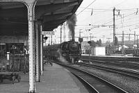 View from the platform of Rheine station in the summer of 1976 as DB 043-196-5 sets off for Emden with a freight. <br>
<br><br>[Peter Todd 17/06/1976]