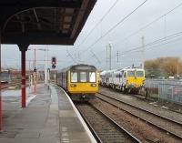 An all stations service from Liverpool via Huyton and Earlestown arrives at Warrington Bank Quay. Running in to the island platform, and passing several stabled track machines, 142048 will shortly retrace its steps back to Lime Street. View north towards Winwick Junction.<br><br>[Mark Bartlett 04/11/2010]