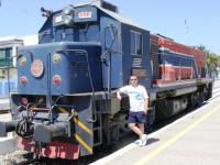Railscot contributor Colin Harkins standing next to locomotive 550 556 at Bir Bou Regba station in Tunisia on 22 August 2010. This loco ran on 1m gauge track.<br><br>[Colin Harkins 22/08/2010]