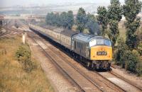 What appears to be class 46 locomotive no 176 passing Ouston Junction in August 1971 with the 10.10 Edinburgh - Kings Cross. The photograph was taken from the embankment of the South Pelaw - Tyne Dock line, which crossed the ECML at this point. <br>
<br><br>[Bill Jamieson 20/08/1971]