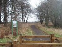 The start of the public footpath section of the old tramway to Ettrick Bay photographed in December 2010. This electrified extension of the former Rothesay to Port Bannatyne horse tramway opened in 1905. In 1931 ownership transferred to Scottish Motor Traction, who immediately cancelled winter services. The double track line closed completely five years later.<br><br>[Mark Bartlett 28/12/2010]