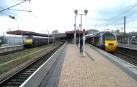 Looking north into York station on 16 July 2007. On the left is a GNER northbound service with a Class 91 on the rear while on the right a southbound HST is boarding.<br><br>[John McIntyre 16/07/2007]