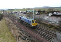 Freightliner 66623 in <I>'Bardon Aggregates'</I> blue livery approaches Carstairs South Junction on 5 February 2011.<br><br>[Ken Browne 05/02/2011]
