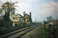 A Norwich to London express is due at Swainsthorpe level crossing on 14th November 1976. The station closed on 5th July 1954 and the building seen here was demolished not long after this photo was taken. The signal box can now be found at Wells at the terminus of the Wells and Walsingham narrow gauge railway.<br><br>[Mark Dufton 14/11/1976]