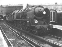 Merchant Navy Pacific no 35003 <I>Royal Mail</I> preparing to leave London's Waterloo station in August 1965 with a Bournemouth line service. The locomotive survived for a further two years before finally being withdrawn from Nine Elms shed in the summer of 1967.<br><br>[Jim Peebles /08/1965]