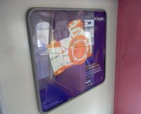 This is a ScotRail poster for Advance tickets, but at first glance I <br>
took it to be an encouragement to photograph railways. I think we can all agree that is a pretty worthless pastime. The pink colour of the divider shows that it was photographed on one of the five Class 322s which will return south later in 2011, the date depending on the Class 380 rollout.<br><br>[David Panton 25/02/2011]