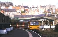 Looking back along the surviving platform towards the station concourse at Whitby in October 1998 as a 3-car DMU prepares to depart with a service to Mddlesborough.<br><br>[Ian Dinmore //1998]