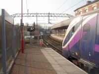Adelante 180108 gets the right away from Platform 0 at Stockport with a Northern service from Preston to Hazel Grove.  Because the sharp curve through this new platform restricts visibility a <I>Banner Repeater</I> precedes the actual colour light signal.<br><br>[Mark Bartlett 24/03/2011]