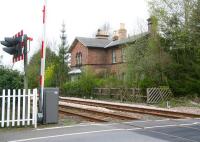 The remains of Strensall station on the north eastern outskirts of York in April 2009. Located on the Scarborough line, Strensall lost its passenger service in the 1930s. View is south west towards York from the level crossing with Strensall signal box behind the camera [see image 50361]<br><br>[John Furnevel 19/04/2009]