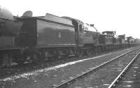 Robinson D11 4-4-0 no 62691 <I>Laird of Balmawhapple</I> stands in the sidings alongside Boness Harbour in February 1962 in company with various other steam locomotives stored there awaiting disposal. Built by Armstrong - Whitworth in 1924, no 62691 had been withdrawn from Haymarket shed 3 some months earlier. It was eventually cut up at Connels of Calder the following March. <br><br>[K A Gray 26/02/1962]