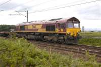 DBS 66151 passes St Germains on 17 May with empty pipe wagons from Leith South yard.<br><br>[Bill Roberton 17/05/2011]
