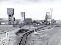 Monktonhall Colliery, located on the west side of Millerhill Yard, seen from the south in 1987. Closed in 1997 and since demolished, it will be the location of Shawfair Station on the reopened Waverley Route.<br>
<br><br>[Bill Roberton //1987]