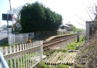The level crossing at the former Flamborough station (closed 1970) in April 2009. The road on the left runs to the village and on to Flamborough Head, while the line continues south past the abandoned platform and converted station building towards the next open station at Bridlington, just over 2 miles further on. [See image 23785]<br><br>[John Furnevel 21/04/2009]