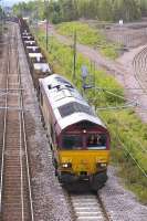 DBS 66025 leaves Millerhill with the 6S58 Lackenby - Dalzell loaded slab train on 20 June.<br>
<br><br>[Bill Roberton 20/06/2011]