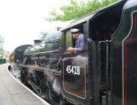 <I>'Wonder what The Bishop would have thought?'</I> The driver of ex-LMS 45428 <I>Eric Treacy</I> seems to be quite taken with the partial LNER green colour scheme created by the reflection of the summer foliage at Pickering on 28 June 2011. The locomotive is about to take out a morning NYMR service to Grosmont.<br><br>[John Furnevel 28/06/2011]