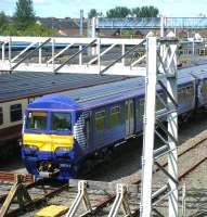 320314 basks in the sunshine at Yoker depot on 23 July 2011.<br><br>[Veronica Clibbery 23/07/2011]