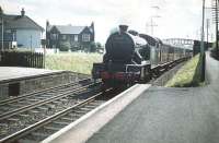 Looking east into the sun at Joppa station on 11 July 1959 as V3 2-6-2T no 67670 brings a Waverley bound train into the platform. A pedestrian footbridge still links Morton Street and South Morton Street in the background - but today's version looks nothing like this one!<br><br>[A Snapper (Courtesy Bruce McCartney) 11/07/1959]