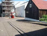 Rails at the Dallas Dhu historic distillery in July 2011 - now a museum operated by Historic Scotland but with bonded warehousing still on the site. The rails lead to two bonded warehouses but are now used to roll whisky barrels along. The Forres - Aviemore line ran behind the buildings in the picture and the bonded warehouses are behind the camera. [See image 16632]<br>
<br><br>[Mark Bartlett 02/07/2011]