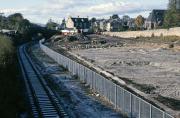 The cleared site of the original Alloa station platforms and goods yard in November 1985, showing retention of a chord of disused track from Cambus through to Kincardine and Longannet. Foundations are being laid for the Leisurebowl complex which still dominated this view in 2011. The foresight of those who insisted that the trackbed should be protected from development is to be highly commended. [See image 13340]<br><br>[Mark Dufton /11/1985]
