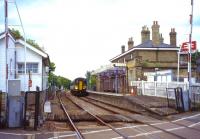 Overlooked by the East Suffolk Line's RETB signalling centre on the left, a Class 153 waits to depart from Saxmundham as the 17.09 to Ipswich on 15th June 2011. <br>
<br><br>[David Spaven 15/06/2011]