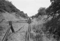 A photograph taken on the BLS 'Forth Fife Railtour' of 28 August 1976 showing the buffer stop on the truncated Kirkliston branch,<br>
looking back north towards the main line and the connection into MOD Royal Elizabeth Yard, Dalmeny.<br>
<br><br>[Bill Roberton 28/08/1976]