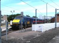 An up GNER service calls at Berwick on 26 August 2004. A view no longer possible due to new fencing.<br><br>[Colin Miller 26/08/2004]