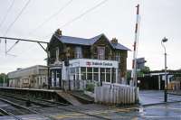 This was the main station in Balloch until 1988 when a new structure was opened on the opposite side of the level crossing [see image 4739]. The relocation became feasible after the extension north to the pier station closed in September 1986, saving all the costs associated with the level crossing and maintenance of the elderly building (now preserved).<br><br>[Mark Dufton 27/05/1985]