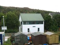 What looks like the former Plockton signal box, is in fact a bunkhouse. Seen here on 22 September looking south across the line from Station Road.<br><br>[Alistair MacKenzie 22/09/2011]