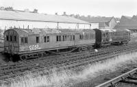 Adjacent to Leith Walk East and the line to Granton, these two former departmental coaches were awaiting disposal on 8 February 1978. Furthest away is a Gresley suburban, while the closer vehicle carried the legend: BR TOOL & MESSING VAN - CHIEF ENGINEERS DEPARTMENT - SAWMILL SIDINGS - LEITH WALK - EDINBURGH - KDM 395890<br>
<br><br>[Bill Roberton 08/02/1978]