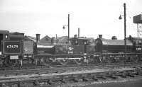A trio of locomotives fresh from a works visit standing in the yard alongside Darlington shed, thought to have been in May 1960. Left to right are V3 67679, J72 69011 and J27 65819. The locomotives would be returning to Glasgow, Hull and Blyth respectively <br><br>[K A Gray 07/05/1960]