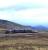 A Transrail-liveried Class 37 breasts Corrour Summit with a short freight heading for Fort William in 1998. [See image 26495] [With thanks to Hamish Ballie, Vic Smith, Ian Mackie and Uilleim Jamieson]<br>
<br><br>[David Spaven //1988]