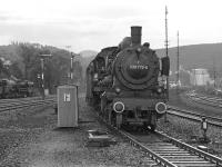 The DB's last operational class 038 4-6-0, No. 038 772, approaches Rottweil station in September 1974 with the 06.47 stopping train from Tuttlingen, some 17 miles to the south. On the left a class 50 2-10-0 is standing at the south end of the shed yard.<br><br>[Bill Jamieson 04/09/1974]