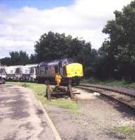 A class 37 with Moorswater - Par clay hoppers at Liskeard in August 1991.<br><br>[Ian Dinmore /08/1991]