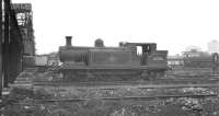 Class E4 Radial 0-6-2T no 32500 stands in the sprawling shed yard at Nine Elms. The locomotive was withdrawn from here at the end of January 1962. Nine Elms shed itself eventually closed in 1967 and the site is now part of the New Covent Garden market. <br><br>[K A Gray //]