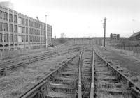 Part of the disused sidings at the former Gorgie Cattle Market looking east towards Gorgie Junction in 1975. The track was later donated by Edinburgh City Council to the Strathspey Railway.<br><br>[Bill Roberton //1975]