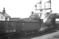 Caley 0-6-0 no 57336 with a rake of empty mineral wagons is held at signals at Ardrossan South Beach station on 25 May 1963. The locomotive was withdrawn from Ardrossan shed 4 months later.<br><br>[R Sillitto/A Renfrew Collection (Courtesy Bruce McCartney) 25/05/1963]