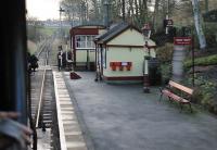 Tiny Damens station, as seen from a passing train (it is a request stop) showing the KWVR passing loop ahead beyond the level crossing. The platform is only the length of one coach but like all KWVR stations Damens is maintained in exceptional period condition. <br><br>[Mark Bartlett 07/01/2012]